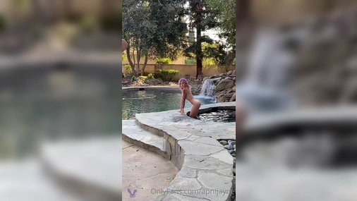 April Jayne Posing In The Fountain