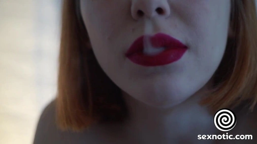 Redhead babe smokes and gives a blowjob to a big cock