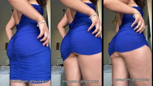 MILF im blauen Kleid, wie sie mit dem Hintern wackelt