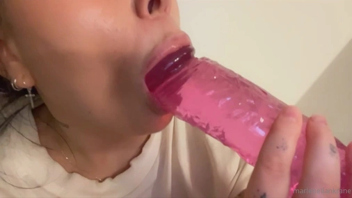 MLK sucking her big pink dildo