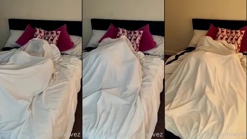 lesbian couple in bed making love