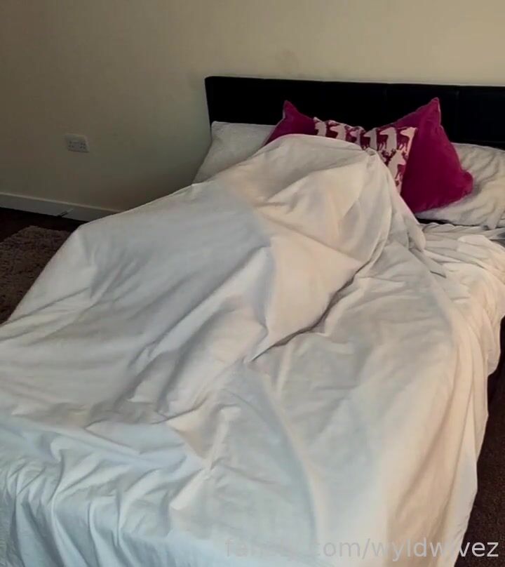 lesbian couple in bed making love